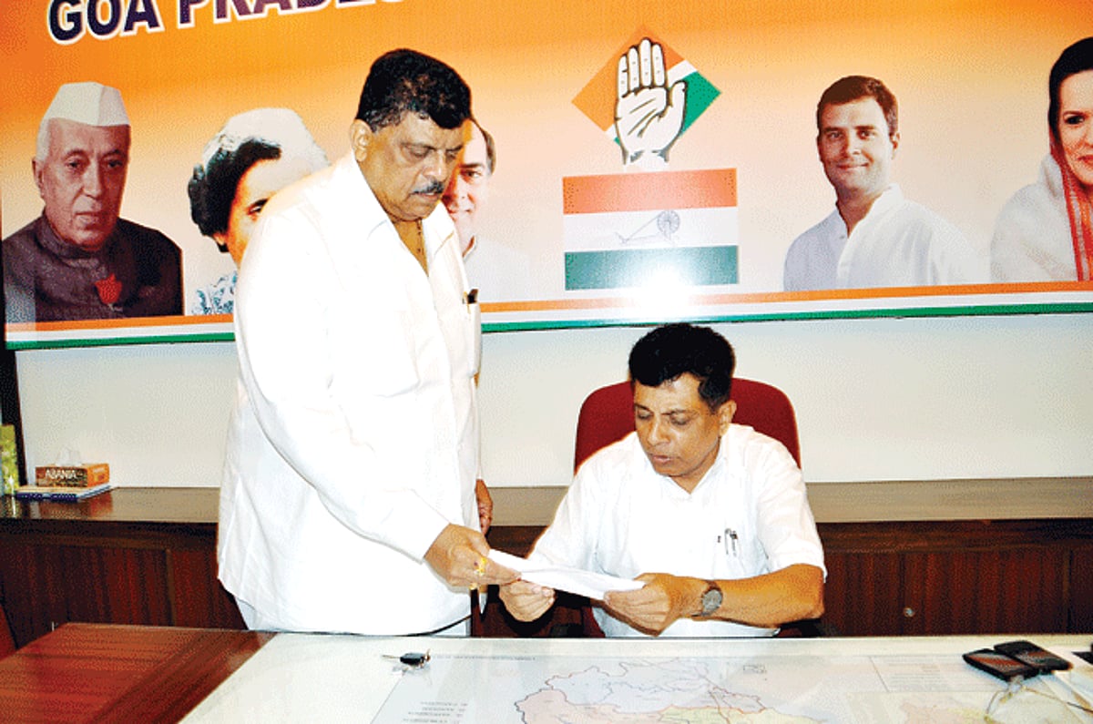 Churchill Alemao handing over his resignation letter to the GPCC chief John Fernandes at the Congress House Panjim on Saturday