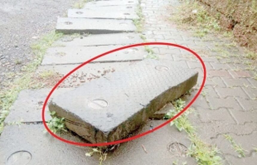 Concrete slab along pavement removed