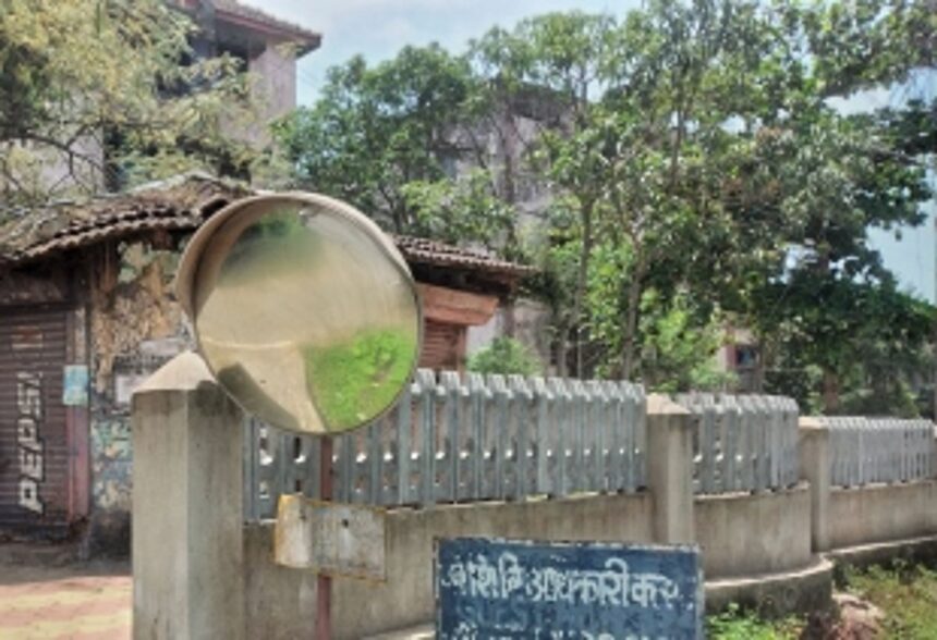 Convex mirrors along road in dilapidated condition