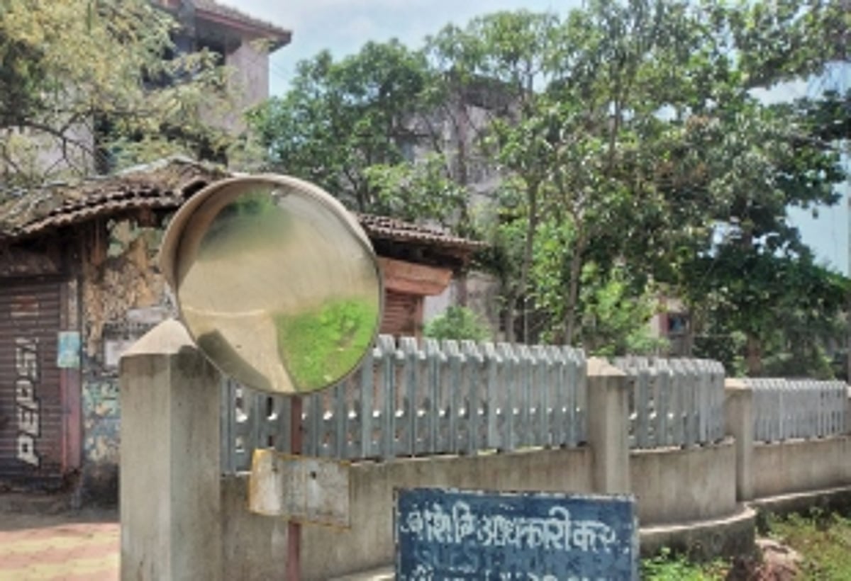 Convex mirrors along road in dilapidated condition