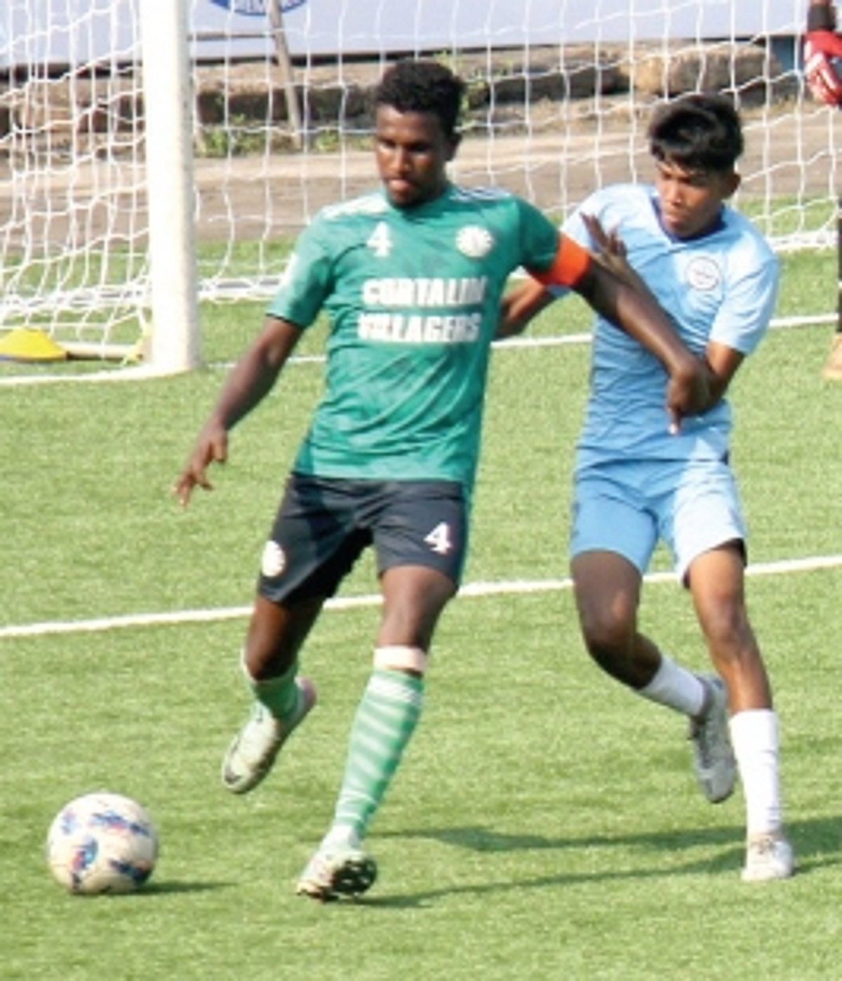 Cortalim Villagers walk past Mumbai City