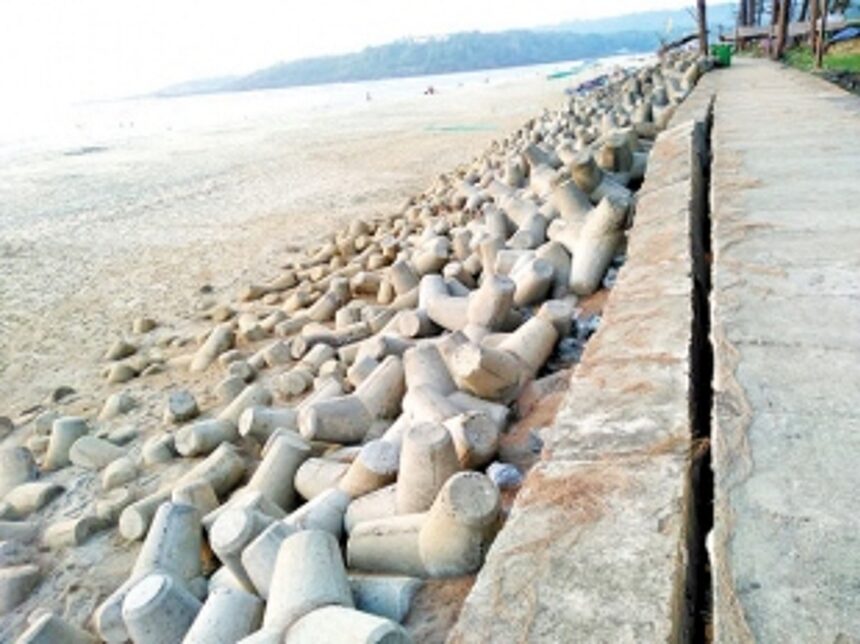 Cracked gabion wall at Keri beach on verge of collapse