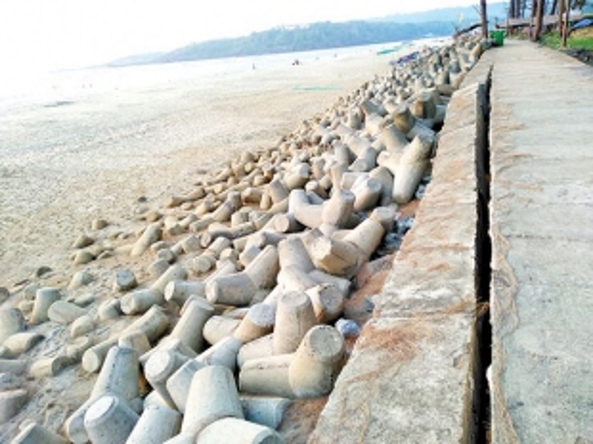 Cracked gabion wall at Keri beach on verge of collapse