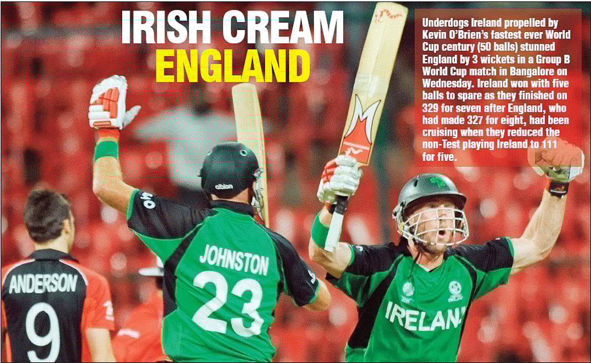 Cricket fans watch the first one-day international match against New Zealand from an under-construction building outside the Nehru Stadium in Guwahati on Sunday. The people stood their ground for nearly eight hours as India battled on to score a 40-run
