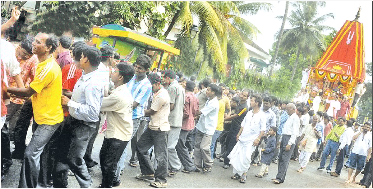 DIVINE SOJOURN: Devotees pull the ceremonial chariot of Lord Jagannath on its Rathyatra from Miramar to the city.