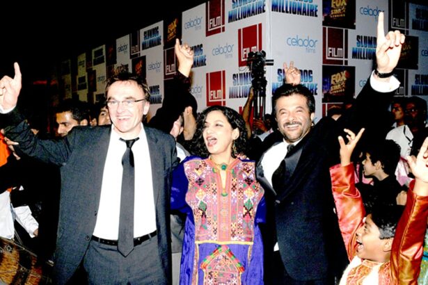 Danny Boyle the Irish-English director of Slumdog Millionaire, Bollywood actress Shabana Azmi and actor Anil Kapoor dance during the premiere of the movie, in Mumbai on Thursday.