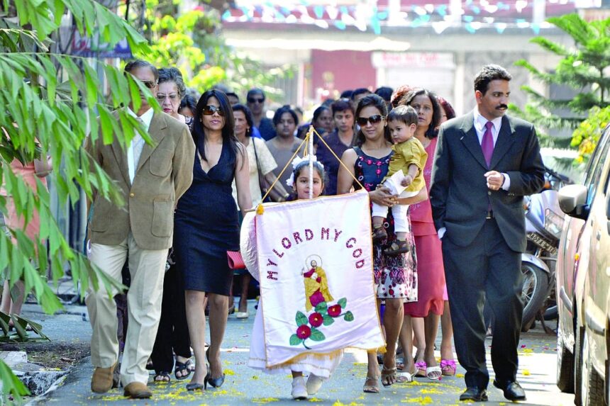 Devotees carrying the banner of St Tome proceed in procession in honour of the saint at Panjim, on Sunday.