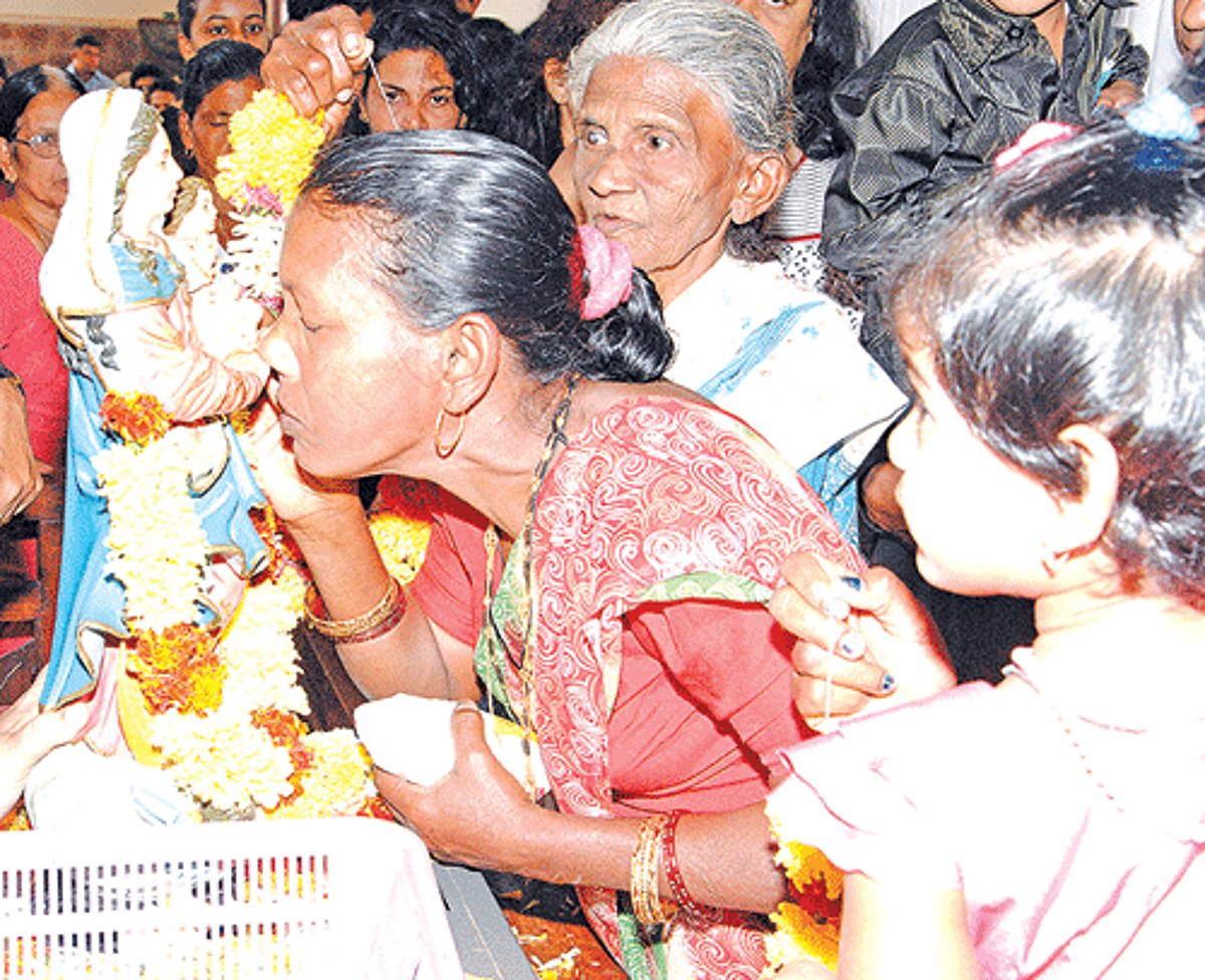 Devotees venerate Our Lady of Health on the occasion of the feast of Our Lady of Health Church, Cuncolim on Sunday.