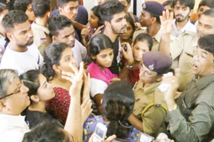 District Collector, ND Agrawal in a heated discussion with a Chowgule HSS teaching staff and students.