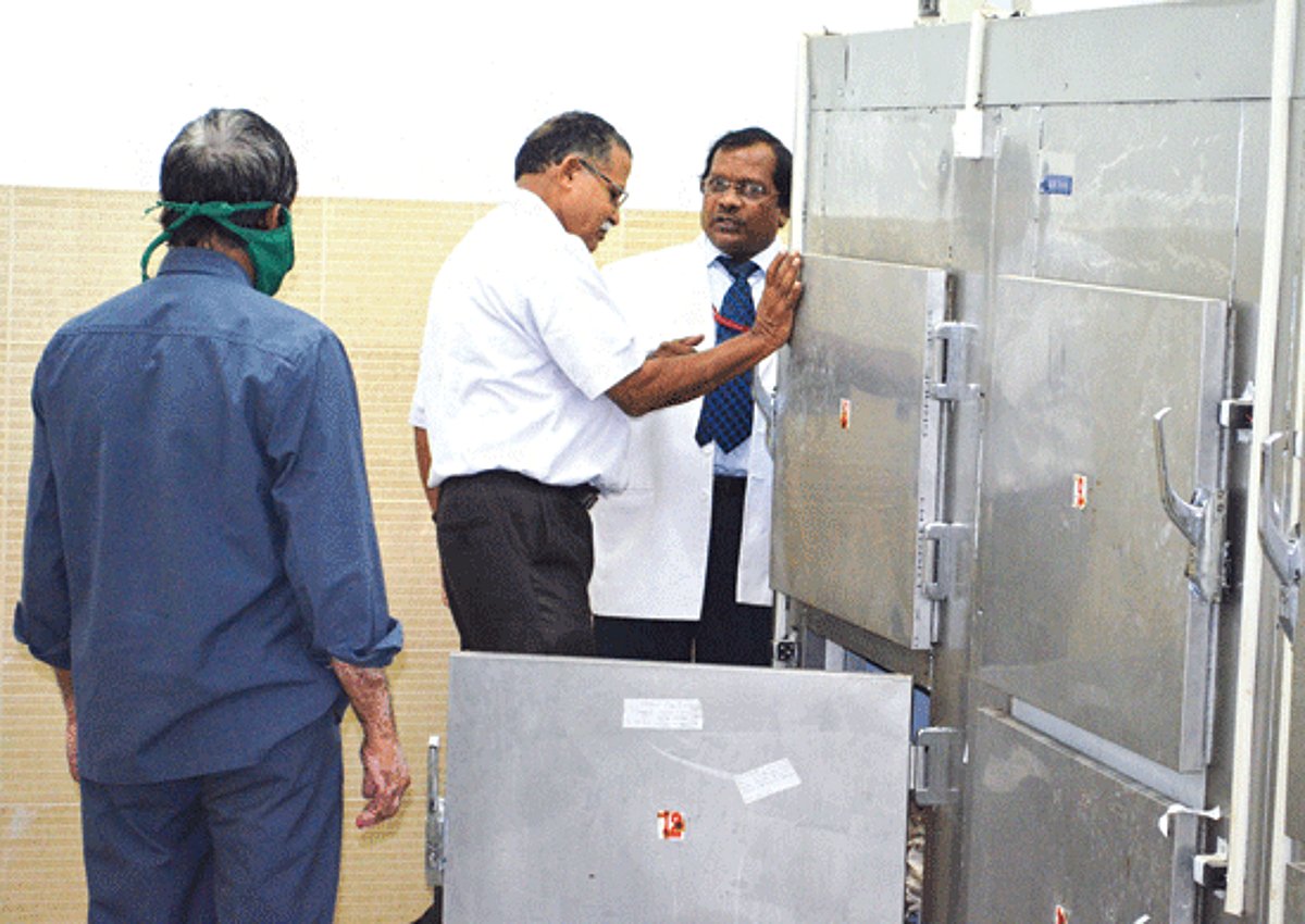 Dr Silvano Dias Sapeco, head of the Forensic Dept at Goa Medical College and Hospital, inspects one of the cubicles in the mortuary at the Ponda Sub-District Hospital in the presence of the hospital Medical  Superintendent, Dr M Mohandas.