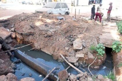Drains through which raw sewage flows into St Inez creek are being covered up