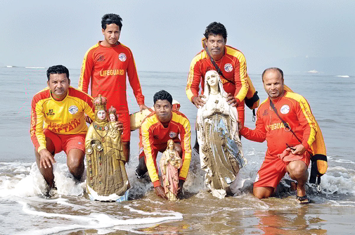 Drishti lifeguards show the three statues of Our Lady of Vailankanni, Our Lady of Lourdes and Sacred Heart of Jesus washed ashore during low tide at Miramar beach. The statues have been kept in the custody of the Drishti Services while no police report h