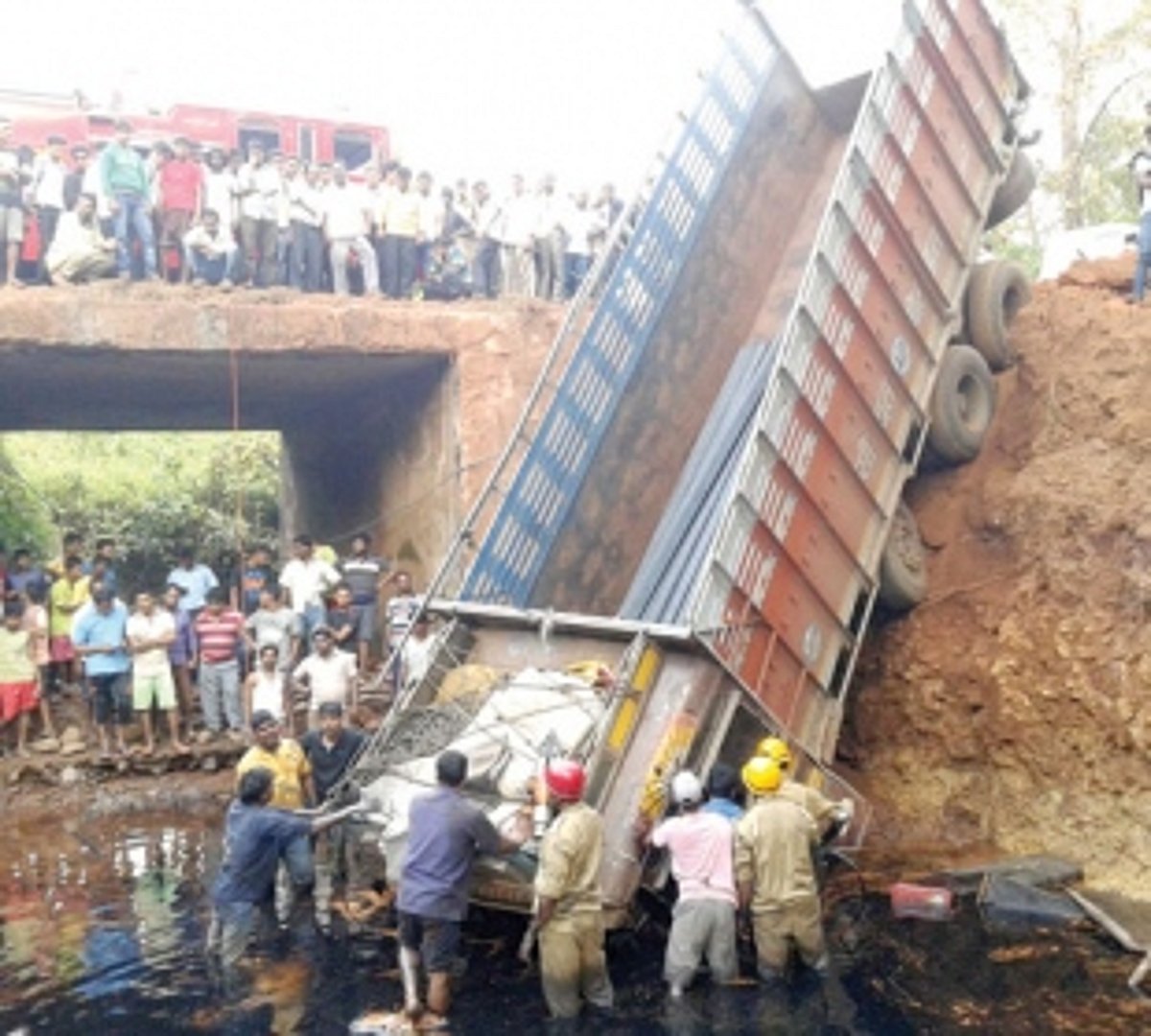 Driver, cleaner injured as truck  plunges into rivulet at Dharbandora