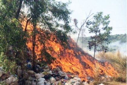 Dry waste piled up beside old dump catches fire