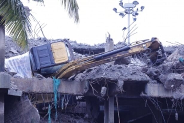 Excavator comes crashing down from 3rd floor of an abandoned building