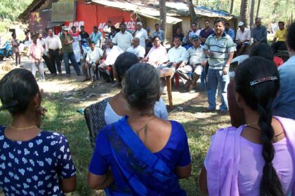 Farmers gather near the Paroda church to protest against government's move to acquire a paddy field.