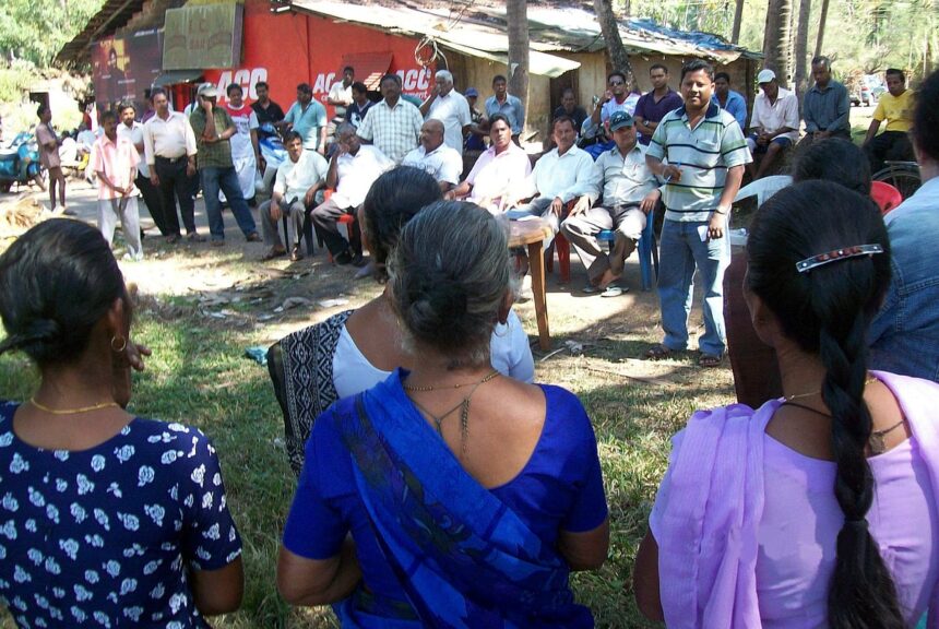 Farmers gather near the Paroda church to protest against government's move to acquire a paddy field.