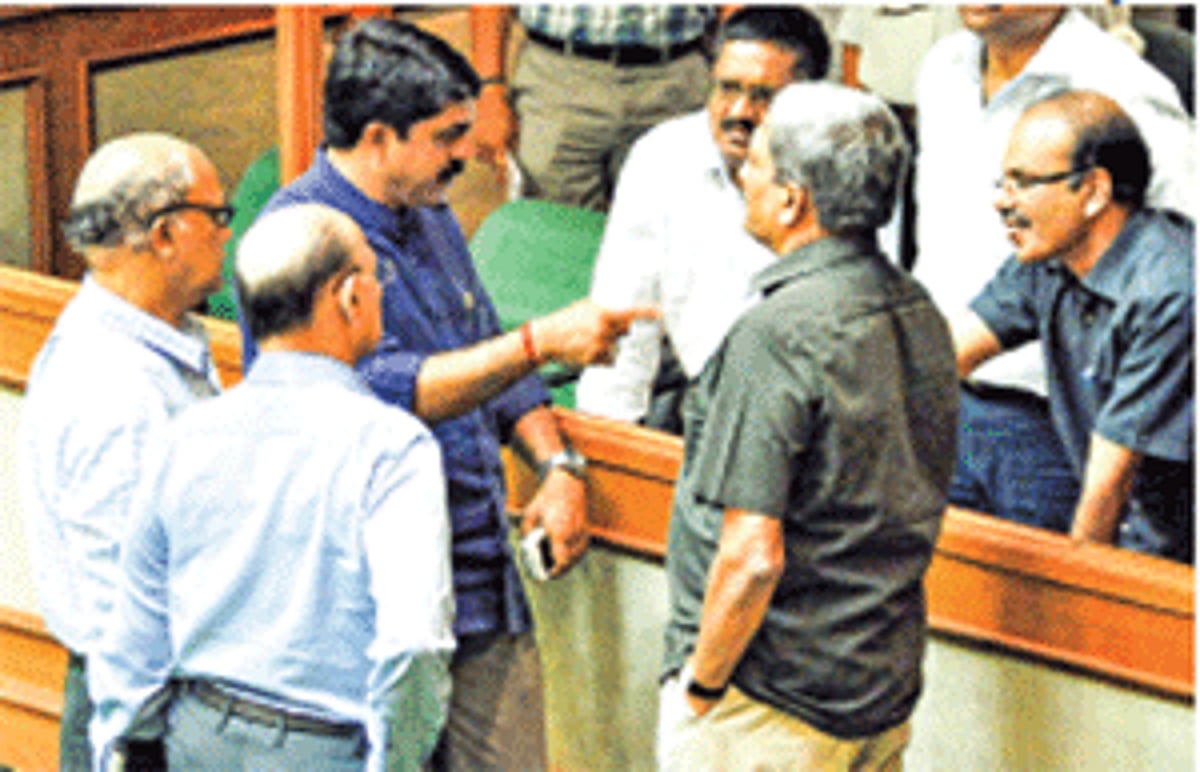 Fatorda MLA Vijay Sardesai has a word with Chief Secretary B Vijayan (extreme right) while Chief Minister Manohar Parrikar, Margao MLA Digambar Kamat and Opposition Leader Pratapsing Rane look on after the zero hour on Friday.