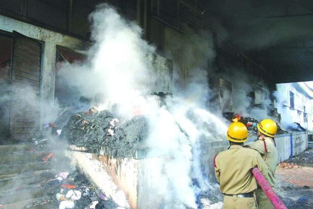 Fire personnel dousing the blaze at Faber Castell, Corlim.