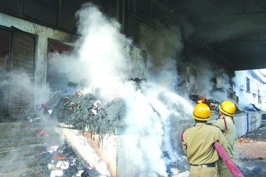 Fire personnel dousing the blaze at Faber Castell, Corlim.