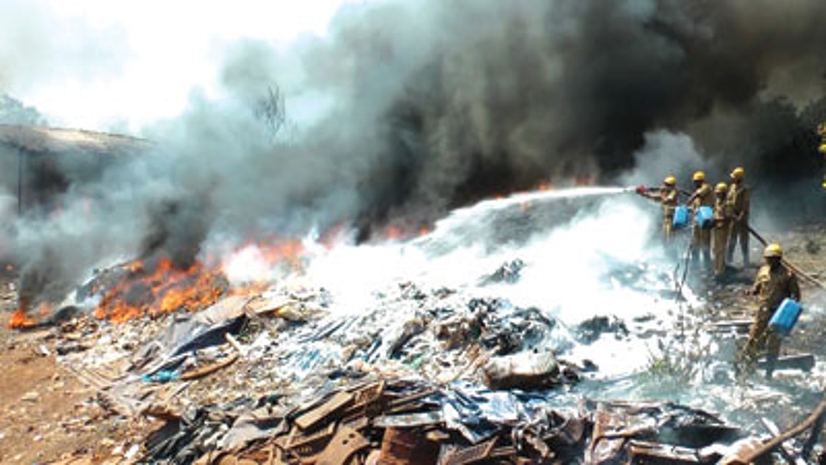 Firemen battling the fire at the Sao Jose de Areal scrapyard