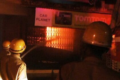 Firemen engaged in dousing the fire.
