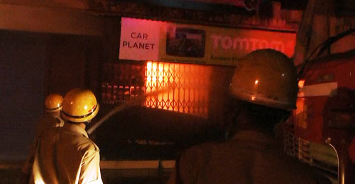 Firemen engaged in dousing the fire.