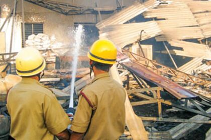 Firemen engaged in fire fighting operations at the Cuncolim Industrial estate
