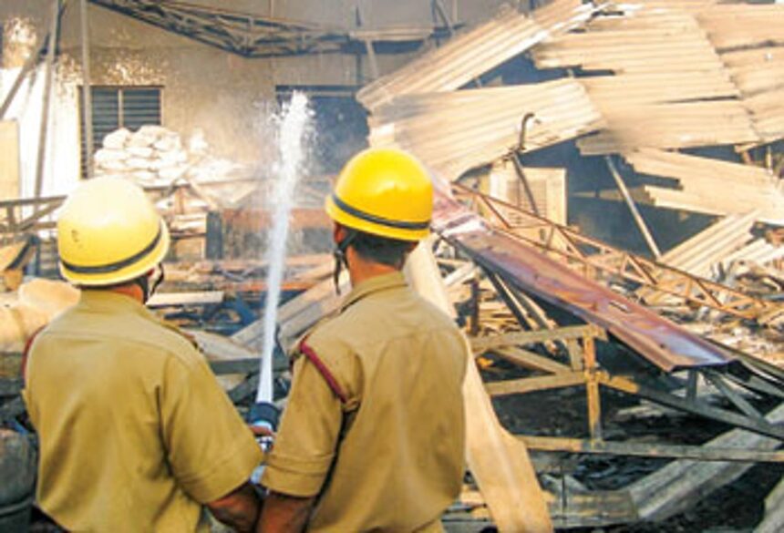 Firemen engaged in fire fighting operations at the Cuncolim Industrial estate