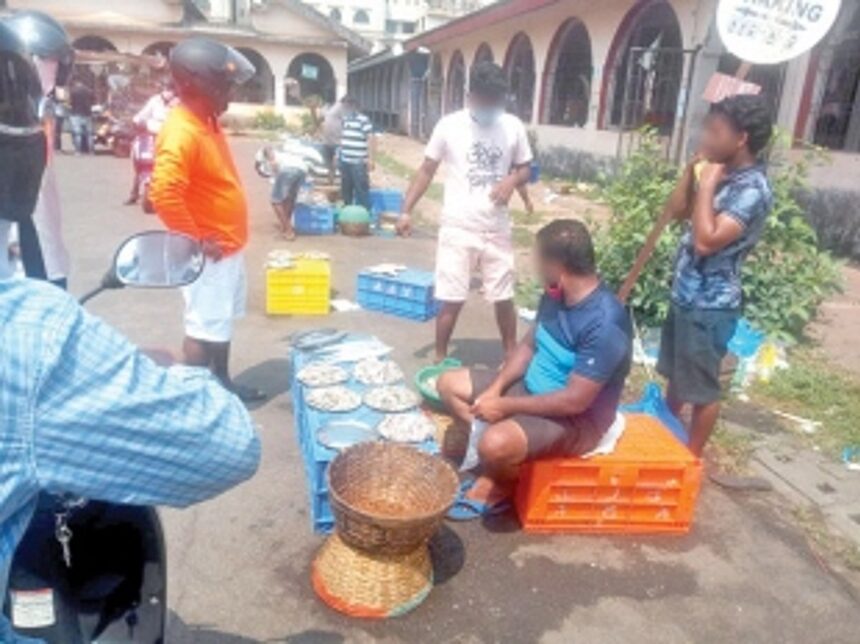 Fish vendors sell fish in the open at SGPDA market