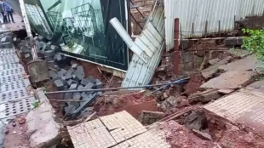 Footpath near BJP office caves in due to heavy unseasonal rains 1 Footpath near BJP office caves in due to heavy unseasonal rains