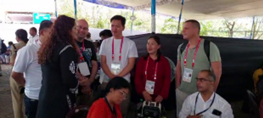 Foreign delegates witness the Indian election process at dispatch centre in Shyamaprasad Stadium