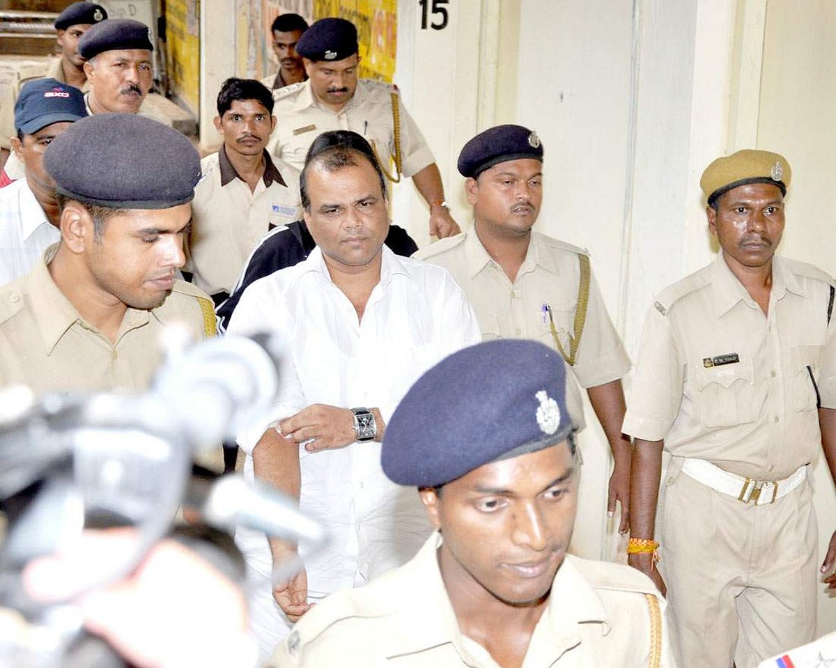 Former tourism minister, Mickky Pacheco escorted by a police party to the Hospicio hospital.