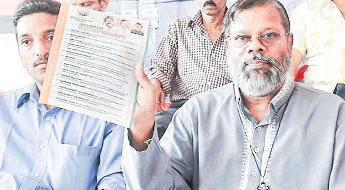 Fr Eremito Rebello shows the BJP 2012 election manifesto