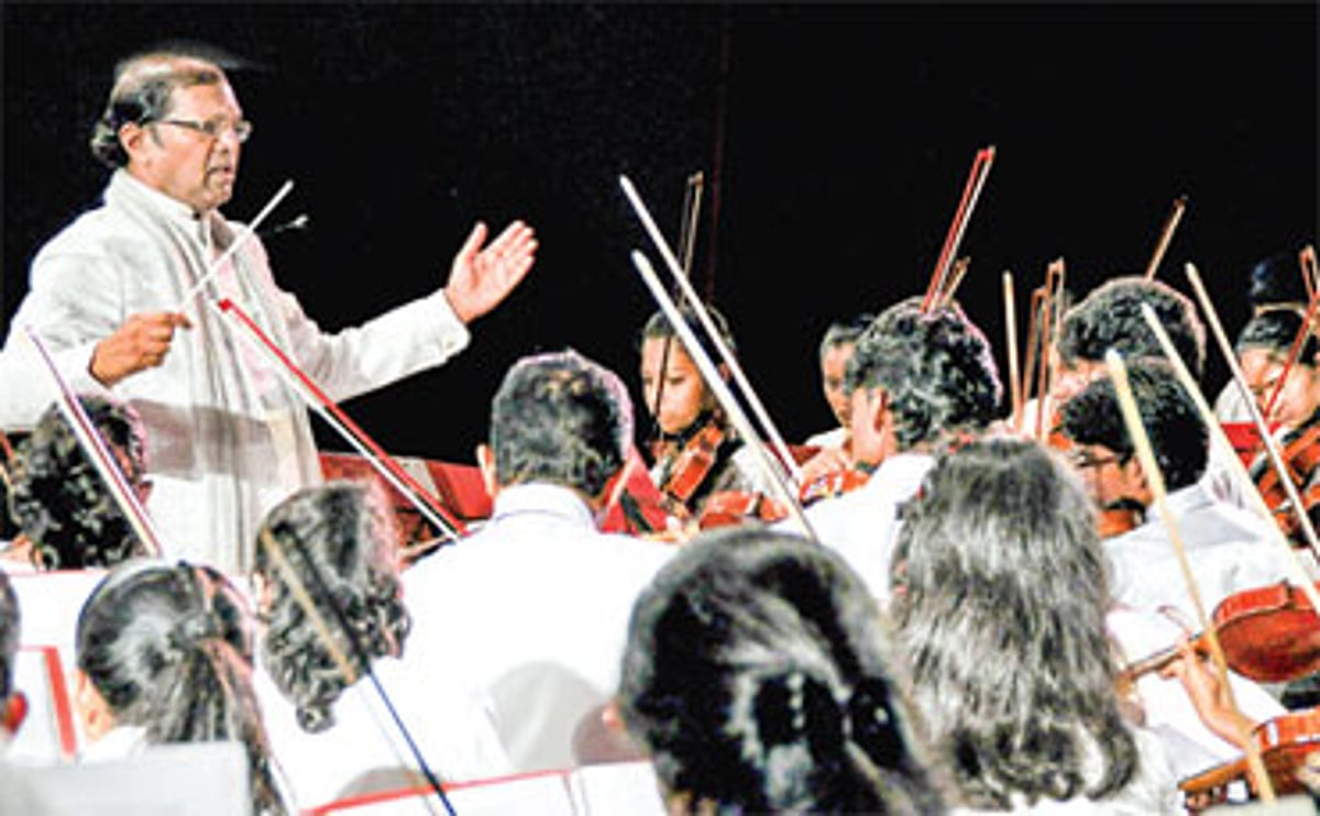 Fr Peter Cardozo conducts the All Goa Fusion Concert