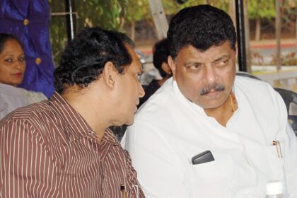 Francisco Sardinha and Churchill Alemao exchange a word at the Congress meeting at Navelim.