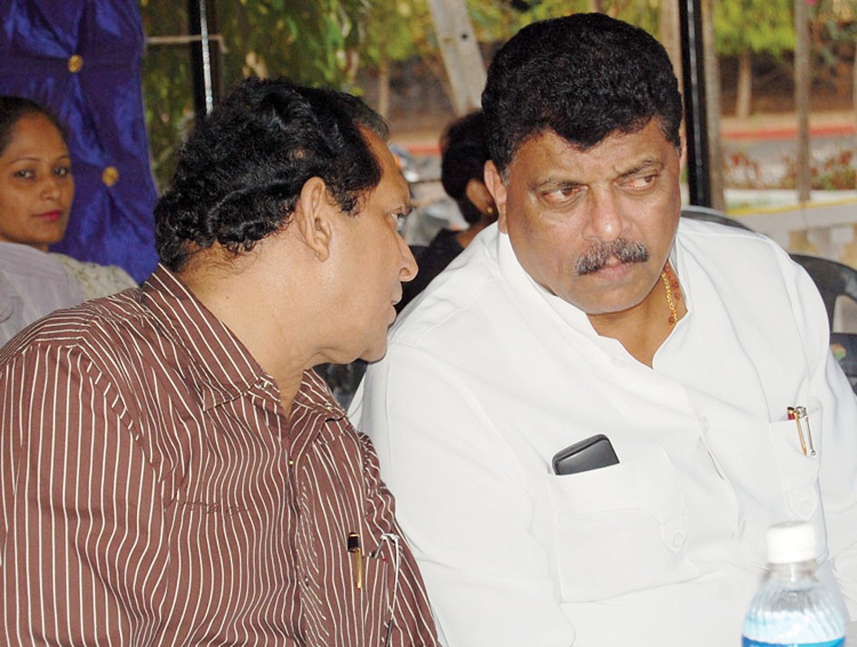 Francisco Sardinha and Churchill Alemao exchange a word at the Congress meeting at Navelim.
