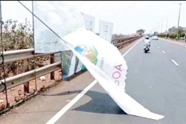 G20 banners put ostensibly to cover a slum area pose danger to motorists