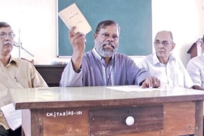 GFDO Convenor Fr Eremito Rebello displaying a history book