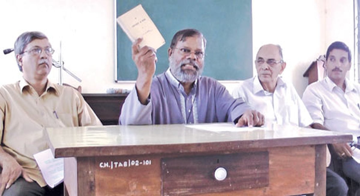 GFDO Convenor Fr Eremito Rebello displaying a history book