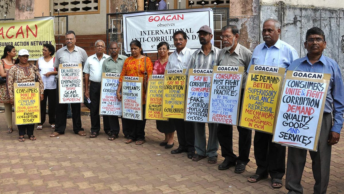 GOACAN volunteers outside the Communidade building, Margao as part of an awareness action against corruption.