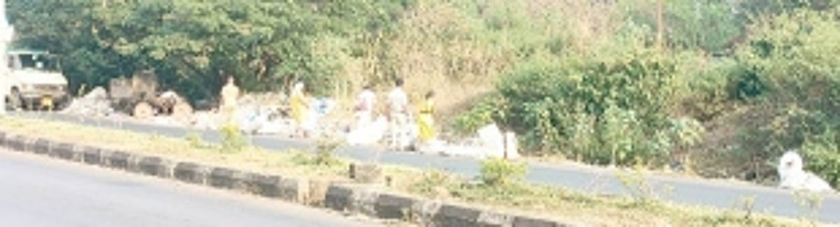 Garbage, construction waste keep getting piled up  by the side of Varunapuri-Shantinagar highway