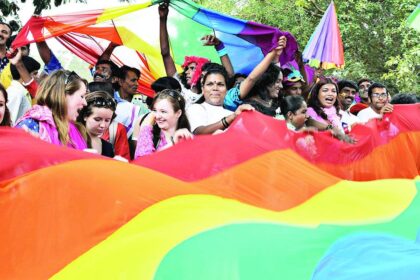 Gay rights activists in India and their supporters carry a rainbow flag as they participate in a gay pride march in Bangalore on Sunday.