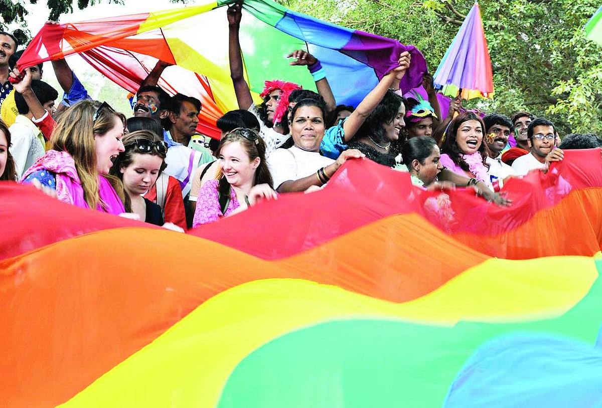Gay rights activists in India and their supporters carry a rainbow flag as they participate in a gay pride march in Bangalore on Sunday.