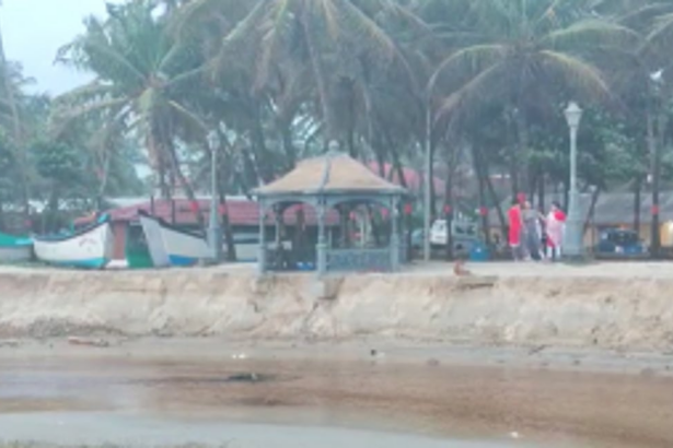 Gazebos, lamp, certain to fall into Colva creek as more sand erodes