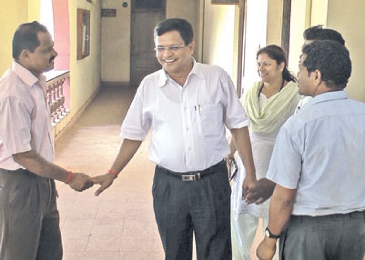 Goa Law Commission Chairman Narendra Sawaikar greets former Sanguem MLA Meng Gaonkar