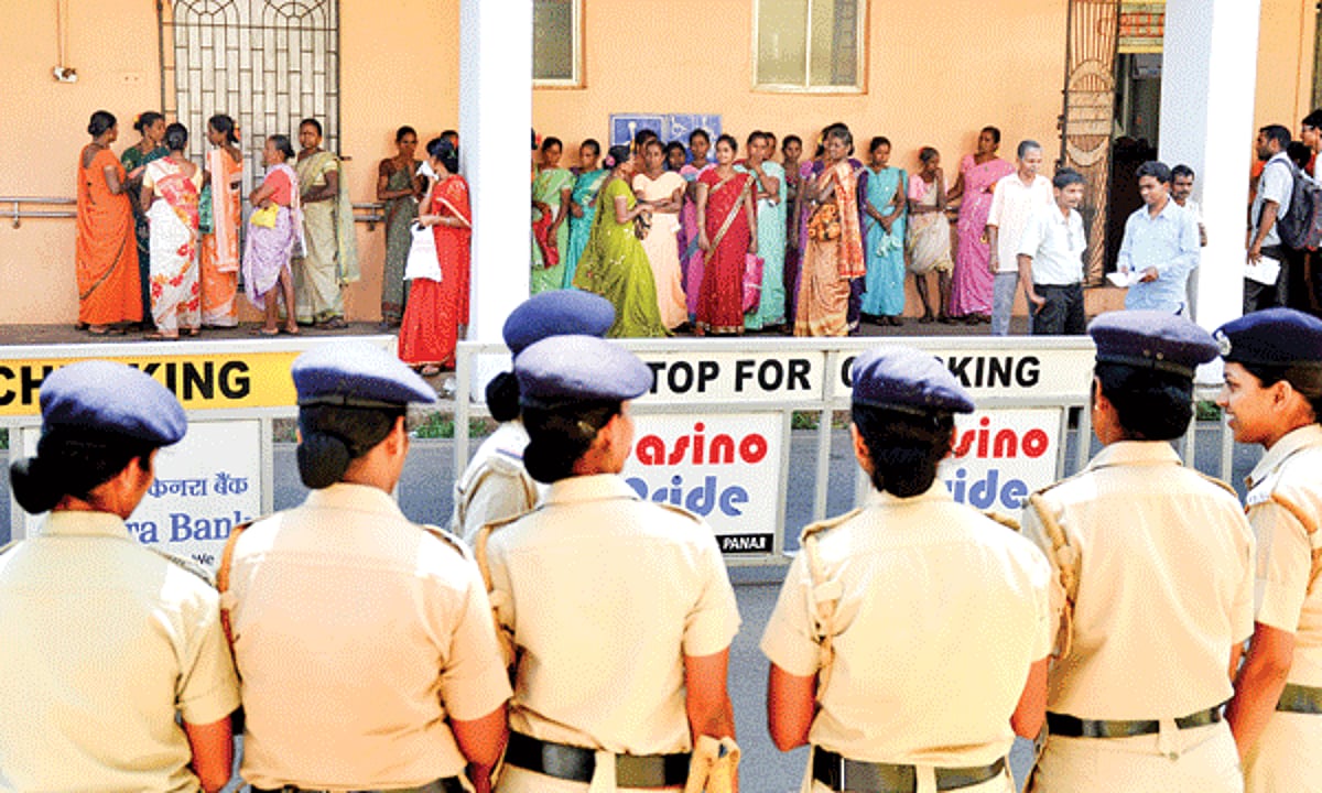 Goa Police lady constables keep a watch on Cavrem villagers who assembled near the Mines Department in Panjim on Tuesday