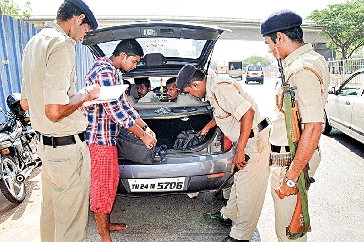 Goa Police personnel check luggage inside an out-of-State car during the Sagar Kavach exercise below Mandovi bridge in Panjim on Tuesday.