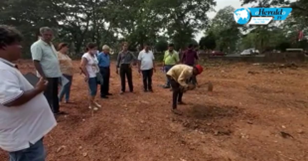 Goa State Pollution Control Board officials collect samples of the waste dumped at Margao