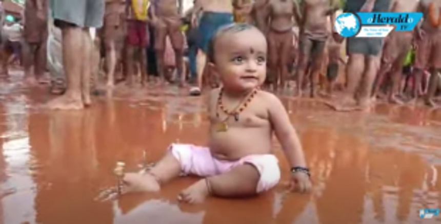 Goans participate in a muddy delight at the chikal kalo festival